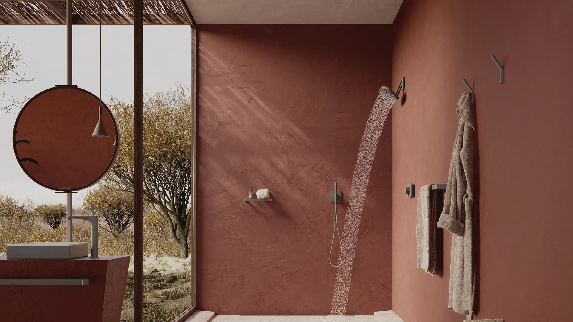 Salle de bains terracotta avec douche et miroir rond